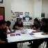 Artist Killy Kilford works with art class.