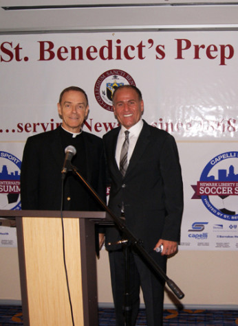 Headmaster Rev. Edwin Leahy, left, stands with CEO of Capelli Sport, George Altirs, right.