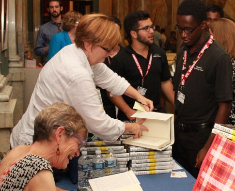 Editor-in-Chief Andrew Sosanya and Sports Editor Rui De Olivera have their books signed.