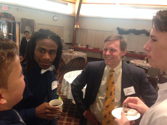 Michael O'Brien, who organized the banquet for Leahy House students, mingles with UDIIs Nicholas Black, Dayln Woody and Micheal Periera (from left to right).