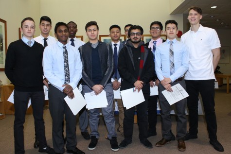 Eleven students were inducted into the NHS in the Radel Library.