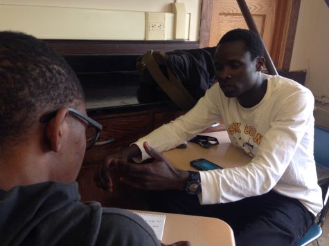 Senior Edwin Rutto as he talks to a reporter about how he will raise his money.