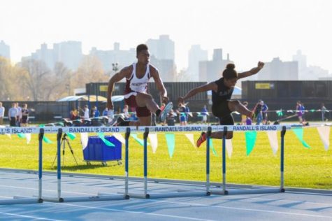 Senior Magnum Phelps hurdling at NY Relays. He finished second running 55.94 seconds.