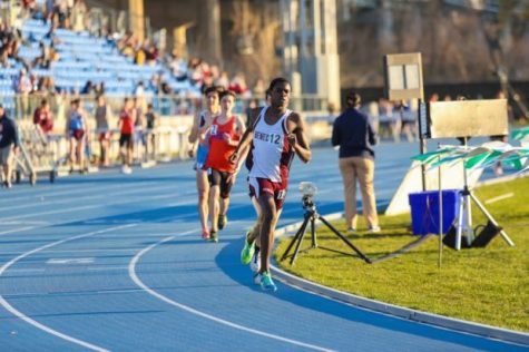 Freshman Ronald Kigen on the final lap of the 3200-meter run. He finished the race running 9 minutes and 37 seconds.