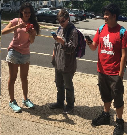 Rutgers students hunt for Pokemon outside the School of Communications.