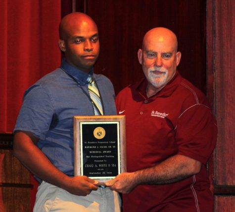 Last year's recipient and Athletic Director Thomas Leahy presenting Algebra I teacher and head crew coach Craig White with the Raymond J. Sachs, Sr. ‘25 Award.