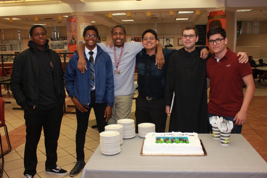 BNews+Banquet%3A+Br.+Asiel+Rodriguez%2C+O.S.B.%2C+second+from+right%2C+convinces+BNews+staffers+to+wait+til+after+dinner+to+eat+the+cake.+%28From+left%29+Jonathan+Dulce%2C+Seun+Eisape%2C+Israel+Small%2C+Yannie+Lopez%2C+Br.+Asiel%2C%2C+and+Kevin+Calle.