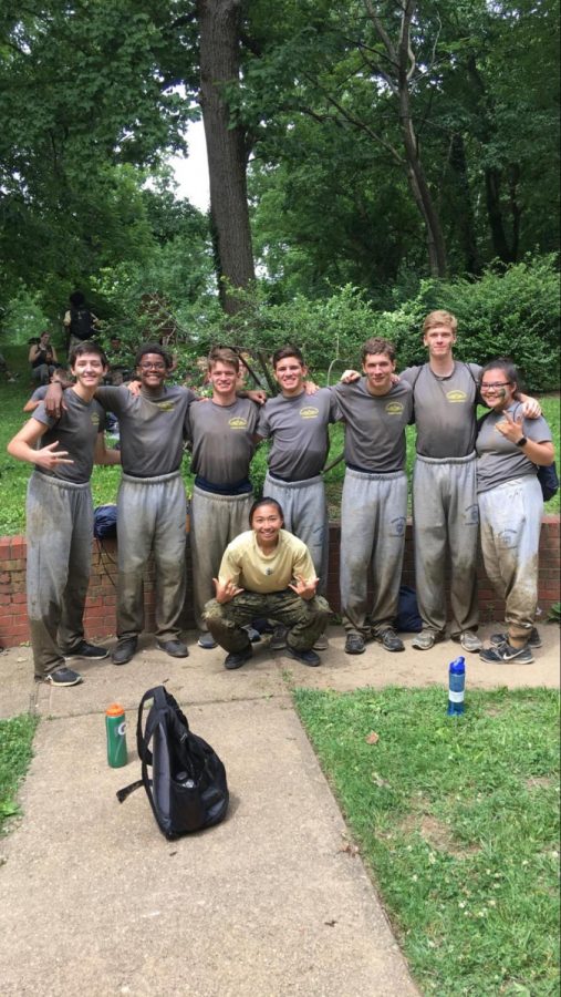 SBP+Senior+Seun+Eisape+%28second+from+left%29+participates+in+a+one-mile-long+obstacle+course+in+the+woods+with+his+squad.