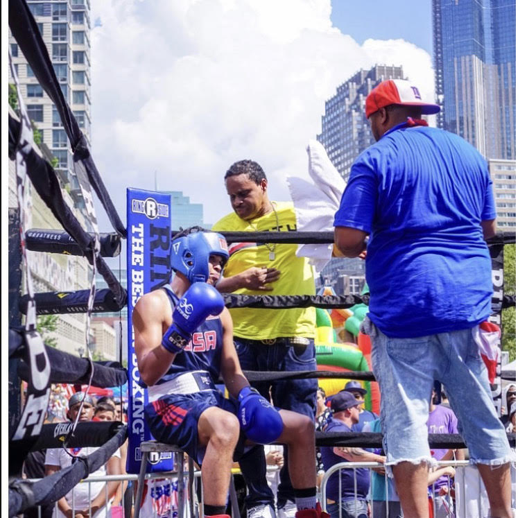 Happier Days: Keith Colon, seen mid-bout, at the 60th Annual Puerto Rican Heritage Festival in Jersey City in August. Colon, a nationally ranked amateur boxer, won the match.