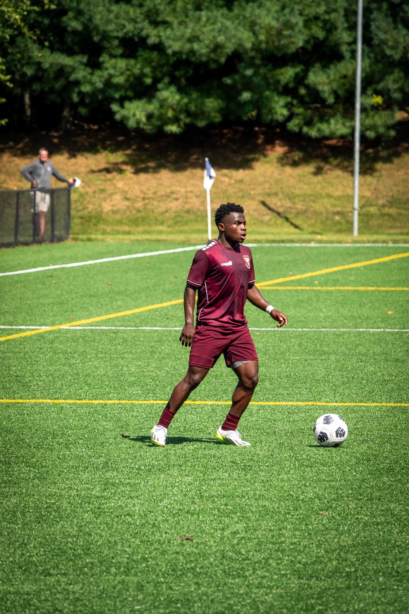 Ransford Gyan (SY) scans the field for support, after the Gray Bees gained possession from the Green Wave. 