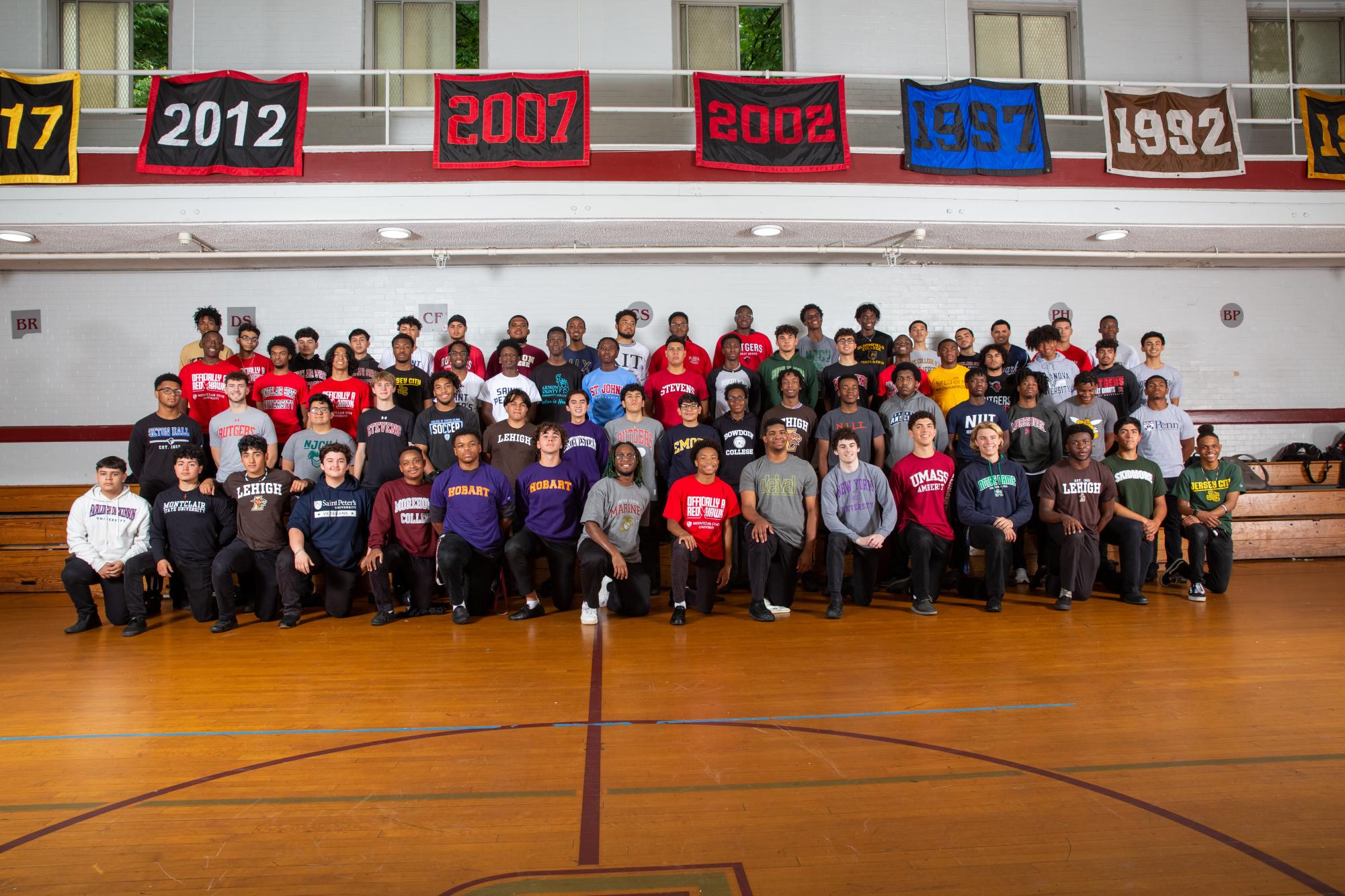 The Class of 2022 representing their College in the Shanley Gym.