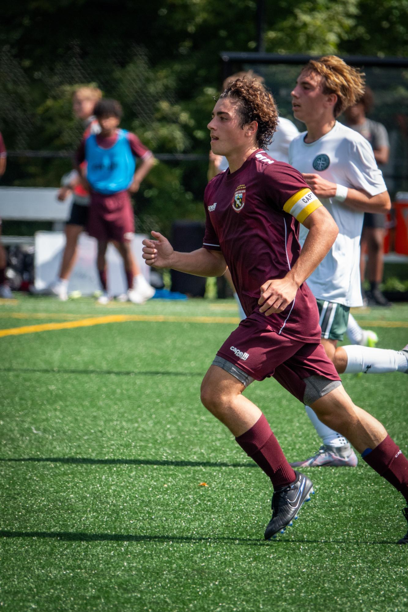 St. Benedicts Prep Varsity Soccer Captain Mark Surretsky runs up the field in a Fall soccer match.